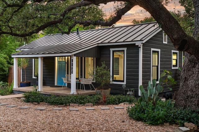 1904 S 6th St, Austin, TX 78704 - view of front facade with a standing seam roof, a porch, and a metal roof