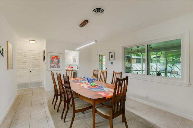 1601 E 19th St, Georgetown, TX 78626 - dining area with light tile patterned flooring and baseboards