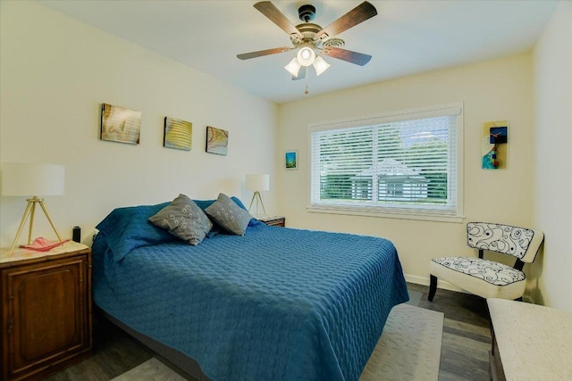 1601 E 19th St, Georgetown, TX 78626 - bedroom with baseboards, a ceiling fan, and dark wood-style floors