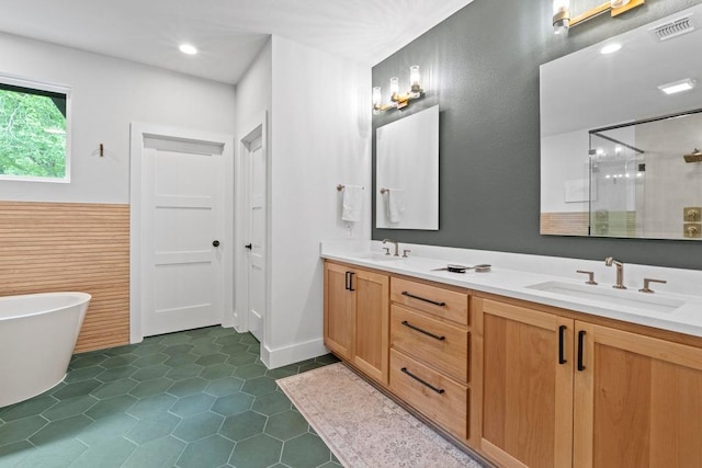 1708 Morrow St, Austin, TX 78757 - full bath featuring a shower stall, double vanity, a freestanding bath, and tile patterned flooring