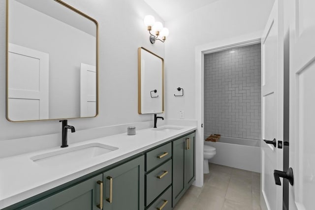 1708 Morrow St, Austin, TX 78757 - bathroom featuring toilet, double vanity, and tile patterned floors