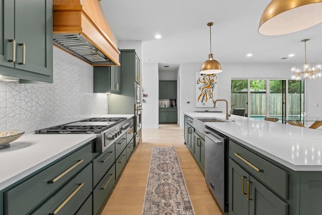 1708 Morrow St, Austin, TX 78757 - kitchen with green cabinets, custom exhaust hood, stainless steel appliances, a sink, and light countertops