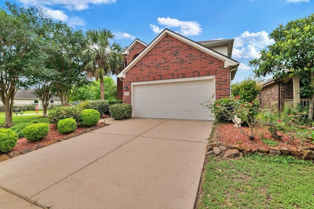 14034 Chelseahurst Ln, Houston, TX 77047 - view of side of property featuring brick siding, concrete driveway, and an attached garage