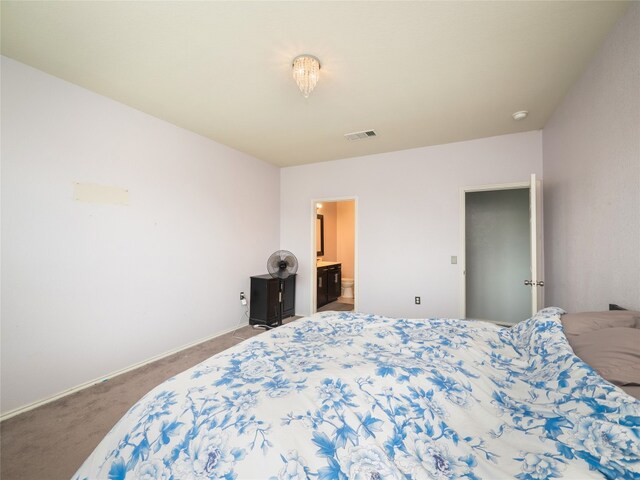 6900 Midlothian Dr, Austin, TX 78754 - bedroom featuring carpet flooring, ensuite bathroom, and baseboards