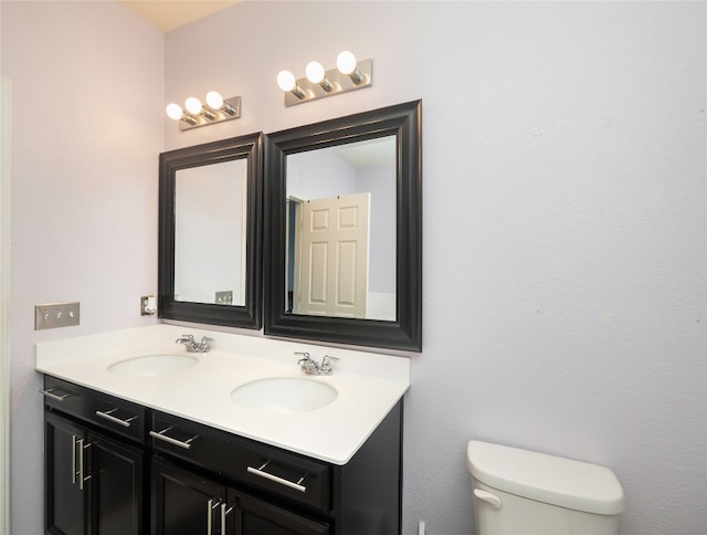 6900 Midlothian Dr, Austin, TX 78754 - bathroom featuring toilet and double vanity