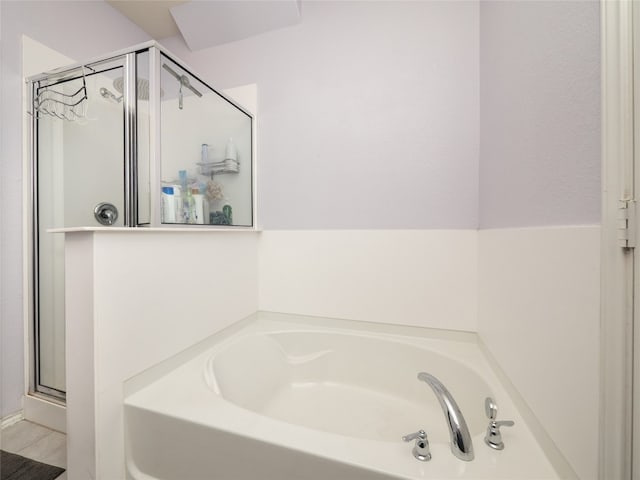 6900 Midlothian Dr, Austin, TX 78754 - bathroom with a bath and a stall shower