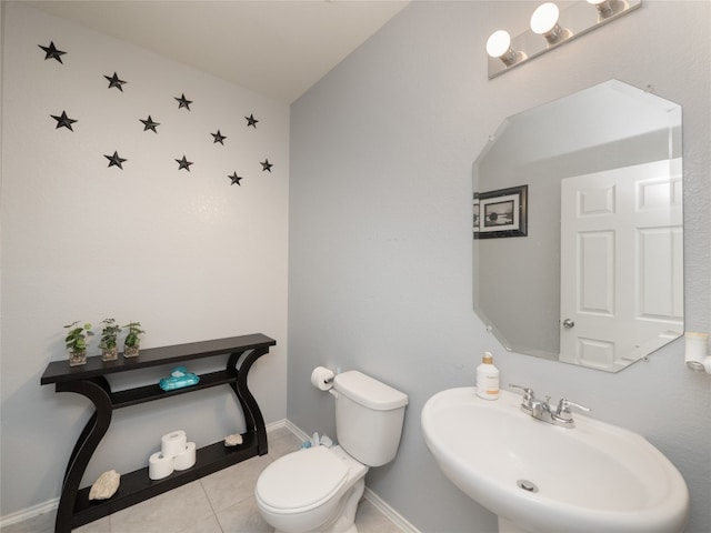 6900 Midlothian Dr, Austin, TX 78754 - half bath with toilet, a sink, tile patterned flooring, and baseboards
