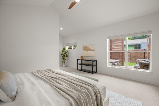 1002 Payne Ave, Austin, TX 78757 - carpeted bedroom featuring vaulted ceiling, multiple windows, ceiling fan, and baseboards