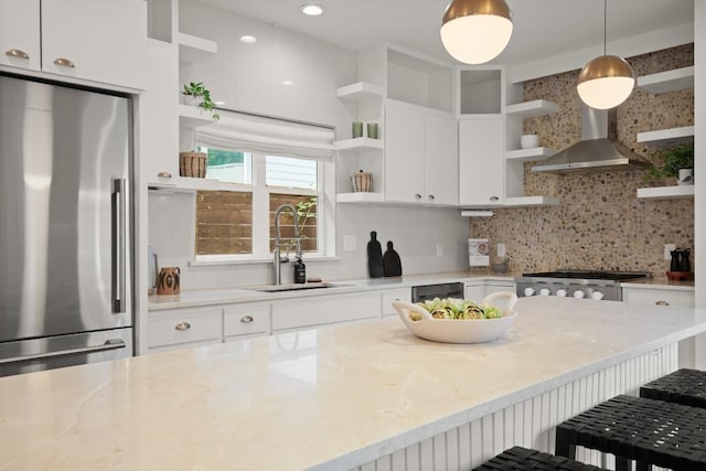 1002 Payne Ave, Austin, TX 78757 - kitchen with open shelves, stainless steel refrigerator, white cabinetry, and decorative backsplash