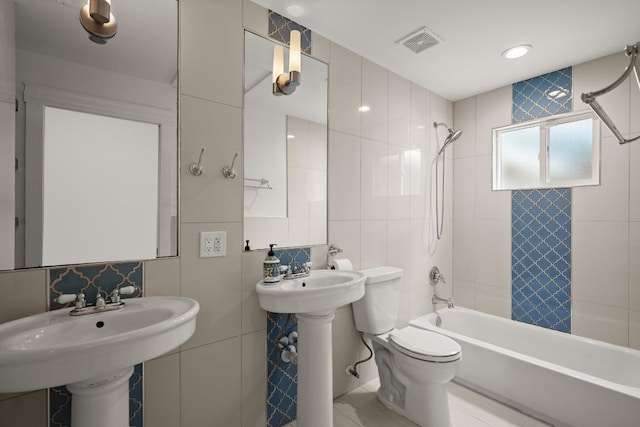 1002 Payne Ave, Austin, TX 78757 - full bath featuring tile walls, bathtub / shower combination, and toilet