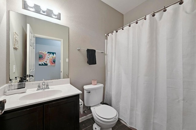 1192 Clark Brothers Dr, Buda, TX 78610 - bathroom featuring toilet, vanity, tile patterned floors, and curtained shower