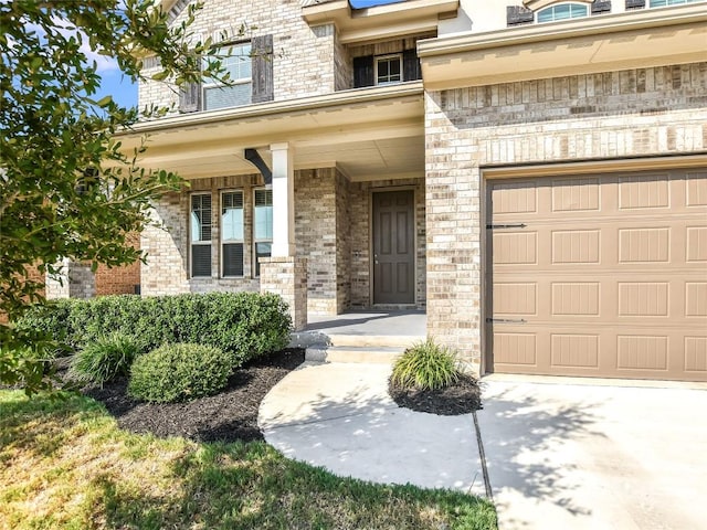 913 Swan Flower St, Leander, TX 78641 - view of exterior entry with a porch, brick siding, and stone siding