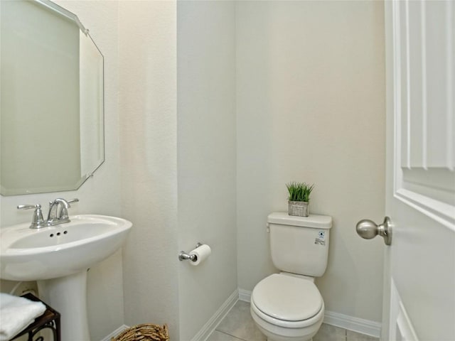 913 Swan Flower St, Leander, TX 78641 - bathroom featuring toilet and tile patterned flooring