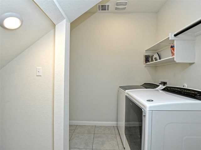 913 Swan Flower St, Leander, TX 78641 - washroom featuring washing machine and dryer and light tile patterned flooring