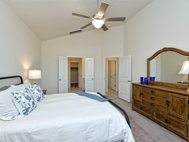 913 Swan Flower St, Leander, TX 78641 - bedroom with light colored carpet, a ceiling fan, and high vaulted ceiling