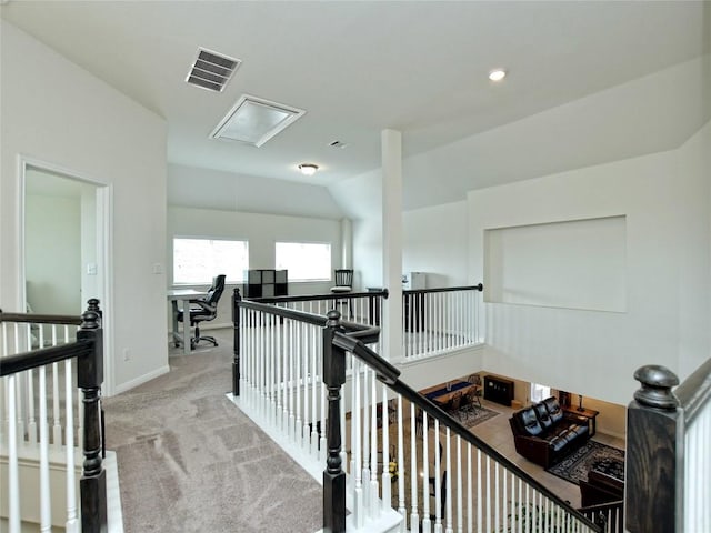 913 Swan Flower St, Leander, TX 78641 - hallway with an upstairs landing, attic access, carpet, and vaulted ceiling