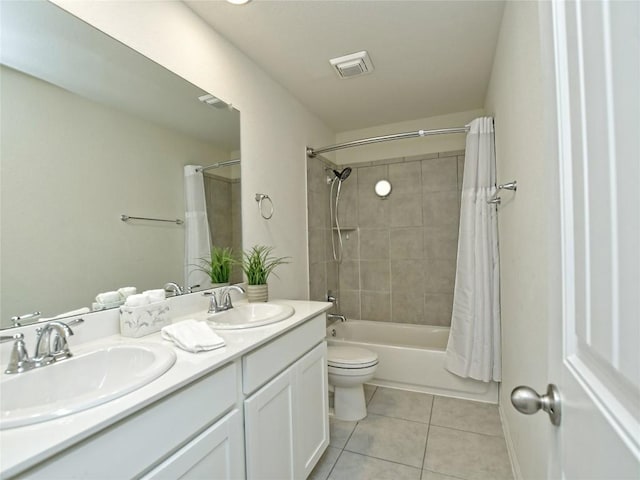 913 Swan Flower St, Leander, TX 78641 - bathroom with tile patterned flooring, toilet, double vanity, and shower / tub combo