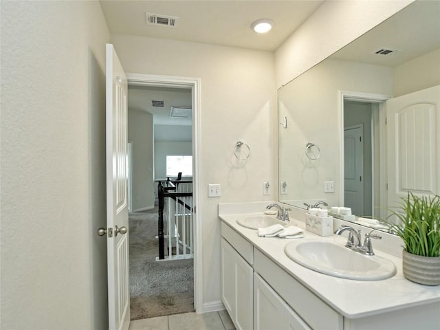 913 Swan Flower St, Leander, TX 78641 - full bath featuring double vanity and tile patterned flooring