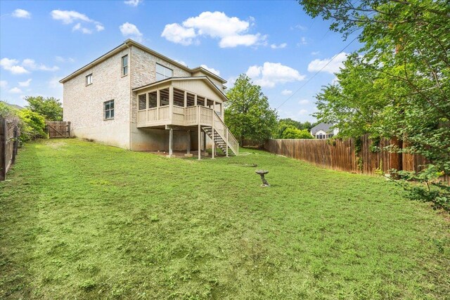 15405 Montoya Cv, Austin, TX 78717 - rear view of property with a sunroom, stairs, and a fenced backyard