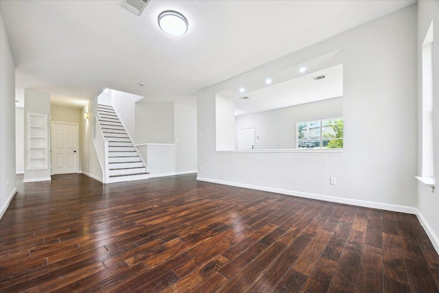 15405 Montoya Cv, Austin, TX 78717 - unfurnished living room featuring stairs, wood-type flooring, and baseboards