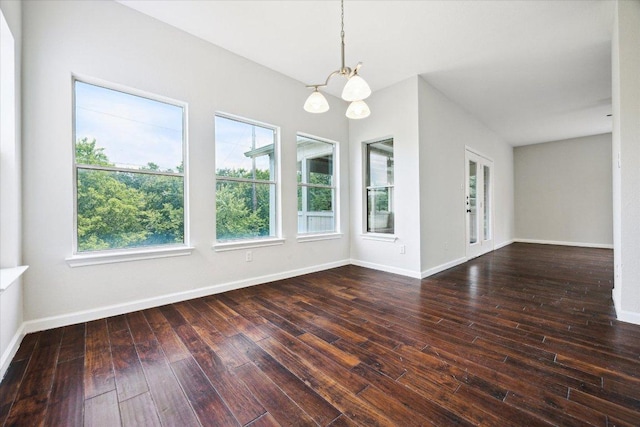 15405 Montoya Cv, Austin, TX 78717 - unfurnished room featuring a chandelier, wood-type flooring, and baseboards