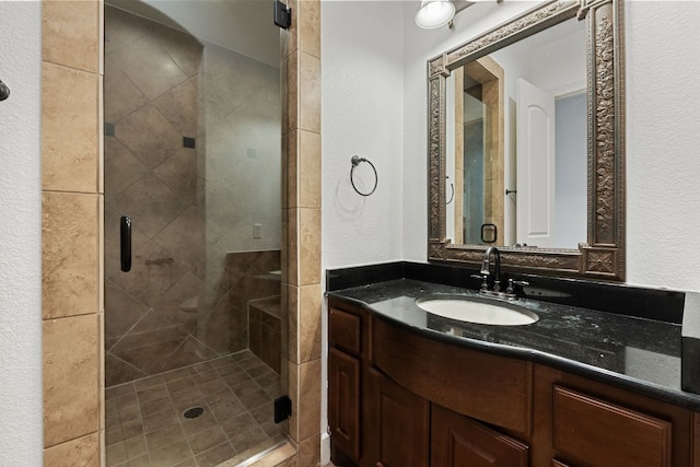 1036 Liberty Park Dr Unit 3, Austin, TX 78746 - bathroom featuring a textured wall, a shower stall, and vanity