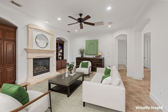 1036 Liberty Park Dr Unit 3, Austin, TX 78746 - living area featuring a ceiling fan, arched walkways, recessed lighting, a high end fireplace, and crown molding