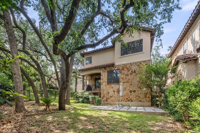 1036 Liberty Park Dr Unit 3, Austin, TX 78746 - back of house featuring stone siding and stucco siding