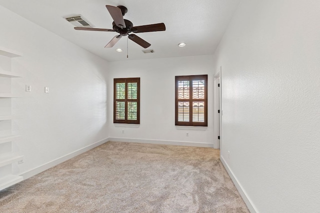 1036 Liberty Park Dr Unit 3, Austin, TX 78746 - spare room with light carpet, a ceiling fan, and recessed lighting