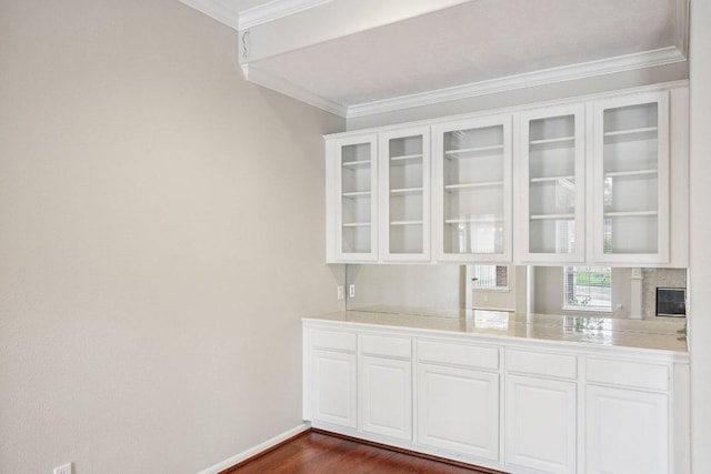 6611 Haughton Dr, Spring, TX 77389 - bar area with ornamental molding and dark wood-style flooring