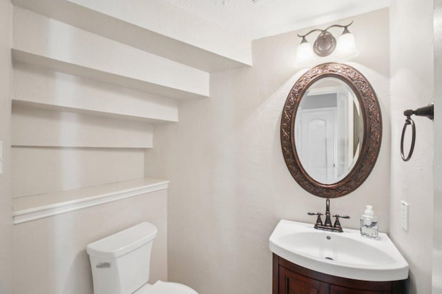 6611 Haughton Dr, Spring, TX 77389 - half bathroom featuring toilet and vanity