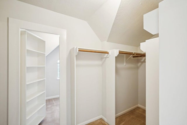 6611 Haughton Dr, Spring, TX 77389 - spacious closet featuring lofted ceiling and carpet