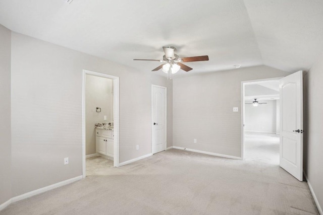 6611 Haughton Dr, Spring, TX 77389 - unfurnished bedroom featuring light carpet, vaulted ceiling, baseboards, connected bathroom, and a ceiling fan