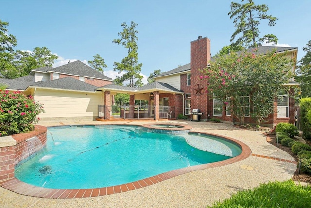 6611 Haughton Dr, Spring, TX 77389 - view of swimming pool with grilling area, a pool with connected hot tub, and a patio area