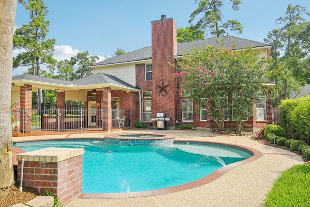 6611 Haughton Dr, Spring, TX 77389 - view of pool with a pool with connected hot tub and grilling area