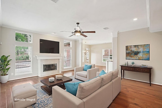 6611 Haughton Dr, Spring, TX 77389 - living room featuring a ceiling fan, wood finished floors, crown molding, a premium fireplace, and recessed lighting
