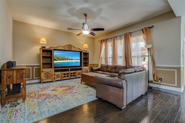 3107 Magnolia Mnr, New Braunfels, TX 78130 - living room featuring ceiling fan, wood finished floors, wainscoting, and a decorative wall
