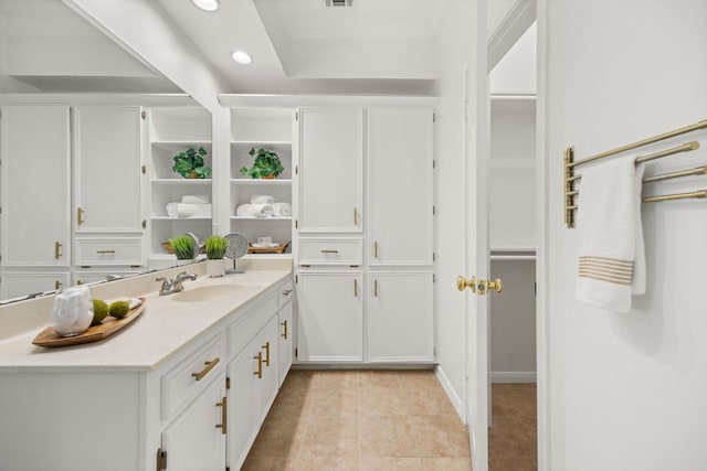 3840 Far W Blvd Unit 213, Austin, TX 78731 - bathroom featuring vanity, tile patterned floors, recessed lighting, a walk in closet, and crown molding