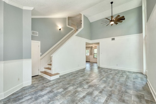 1506 Spiderlily Vw, Cedar Park, TX 78613 - unfurnished living room with high vaulted ceiling, ceiling fan, stairs, baseboards, and a textured ceiling