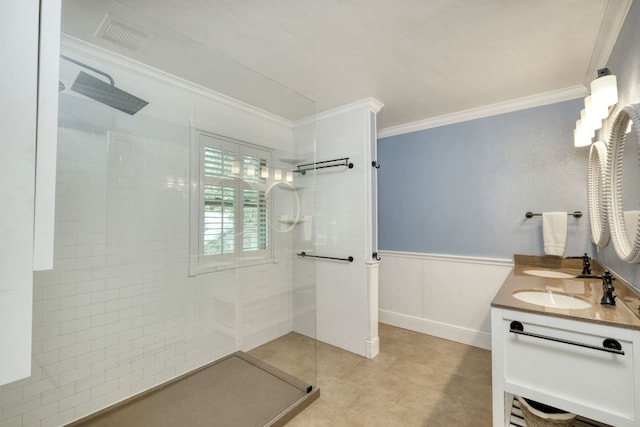 1506 Spiderlily Vw, Cedar Park, TX 78613 - full bathroom with ornamental molding, a walk in shower, double vanity, wainscoting, and tile patterned floors