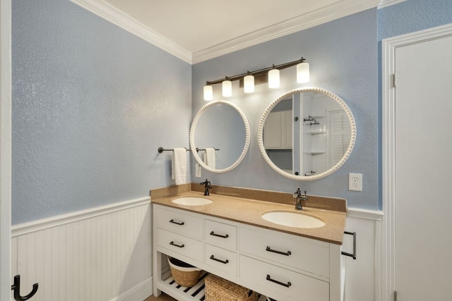 1506 Spiderlily Vw, Cedar Park, TX 78613 - full bathroom featuring double vanity, crown molding, a wainscoted wall, and a textured wall