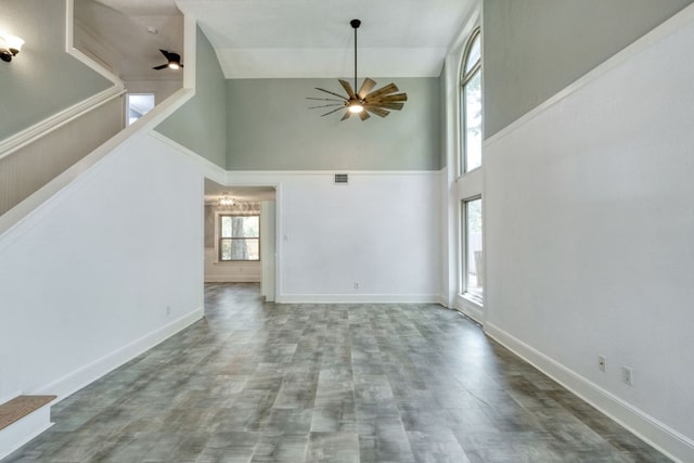 1506 Spiderlily Vw, Cedar Park, TX 78613 - unfurnished living room featuring high vaulted ceiling, a ceiling fan, baseboards, and wood finished floors