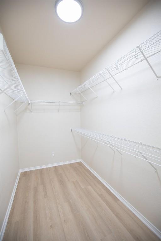 2308 Lou John St, Austin, TX 78727 - spacious closet with light wood finished floors