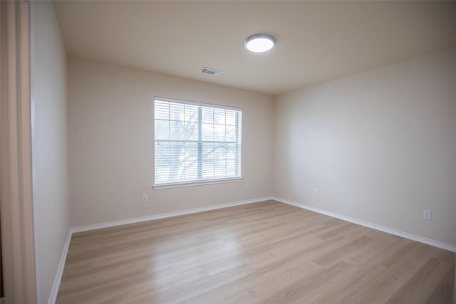 2308 Lou John St, Austin, TX 78727 - empty room with light wood-style floors and baseboards