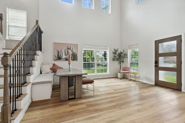 800 Newcastle Dr, Austin, TX 78745 - entryway featuring a towering ceiling, light wood finished floors, and stairway