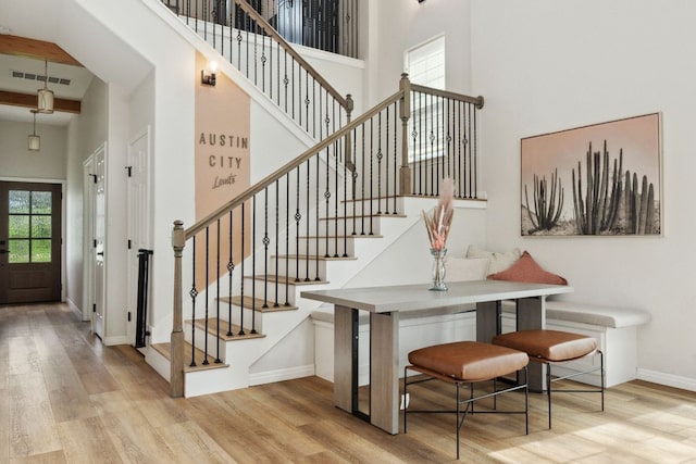 800 Newcastle Dr, Austin, TX 78745 - staircase with a towering ceiling and wood finished floors