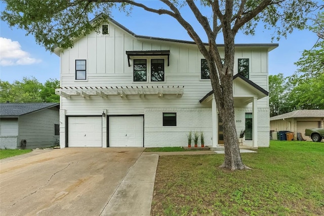 800 Newcastle Dr, Austin, TX 78745 - view of front of home with board and batten siding, driveway, an attached garage, and a front yard