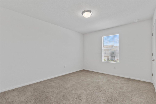 336 Wonderful Life Way, Jarrell, TX 76537 - spare room featuring carpet and baseboards