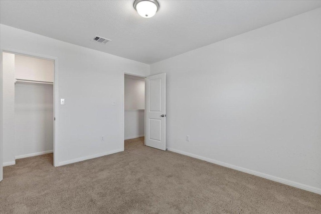 336 Wonderful Life Way, Jarrell, TX 76537 - unfurnished bedroom with carpet floors, baseboards, and a spacious closet