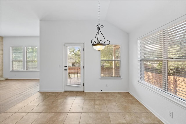 250 Maeves Way, Austin, TX 78737 - unfurnished dining area featuring lofted ceiling and light tile patterned flooring